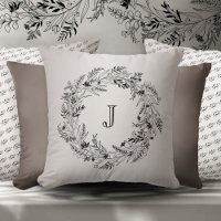 Flowing botanical wreath around letter J