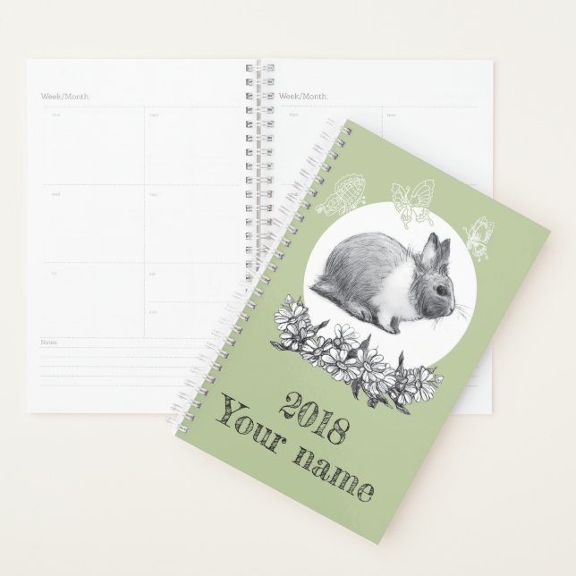 Fluffy hare with butterflies on green background planner (Display)