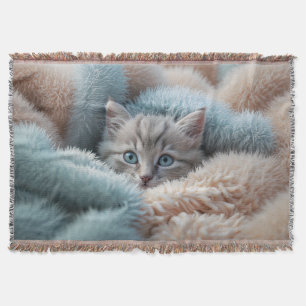 Fluffy Kitten in a Soft Blanket