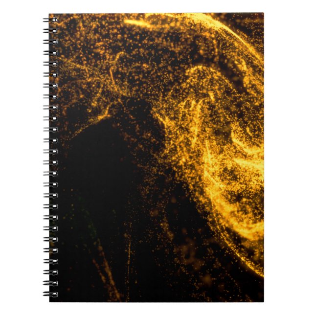 Fluid gold colour particles flowing beautiful with notebook (Front)