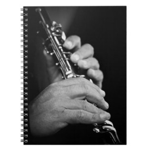 Flute being played in black and white by gypsy spiral notebook