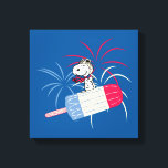 Flying Ace Snoopy on Ice Pop Canvas Print<br><div class="desc">Peanuts 4th of July | Check out Flying Ace Snoopy on a red,  white,  and blue ice pop,  riding past fireworks in the sky!</div>