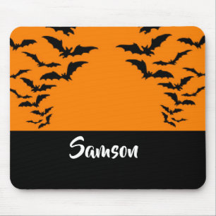 Flying bats on orange mouse pad