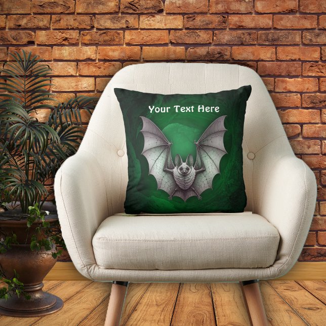 Flying Grey Bat Spooky Green Glowing Cave Cushion (Grey bat flying from spooky glowing green cave with trees on Halloween throw pillow.)