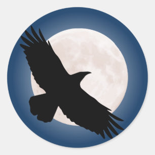Flying raven with the moon behind it classic round sticker