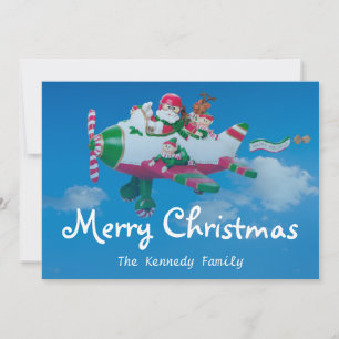 Flying Santa Claus with Elves in Aeroplane Holiday Card