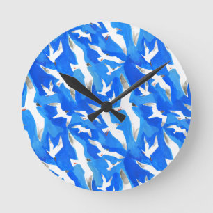 Flying seagulls on sky blue round clock
