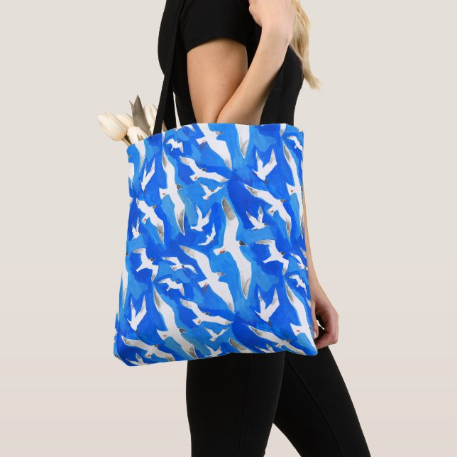 Flying seagulls on sky blue tote bag (Close Up)