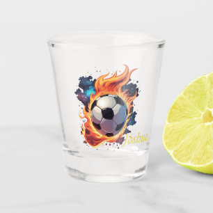 Flying soccer ball with flames. shot glass