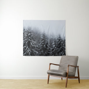 Fog over snow covered spruce forest in winter tapestry