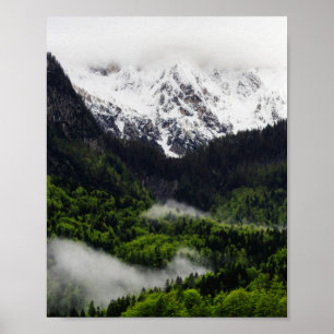 Fog rolling through forest below mountains poster
