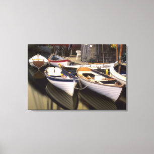 Fog surrounds four boats docked. canvas print