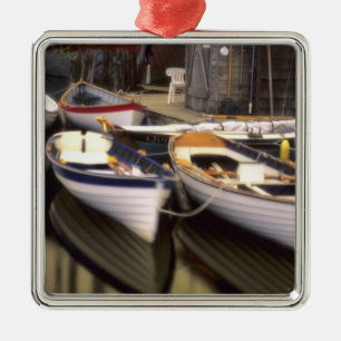 Fog surrounds four boats docked. metal tree decoration