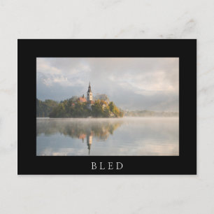 Foggy Bled Lake sunrise in autumn in Slovenia Postcard