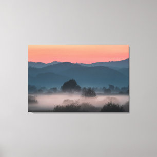 Foggy landscape at sunset canvas print