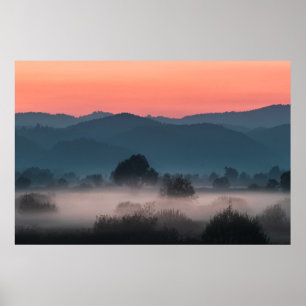 Foggy landscape at sunset poster