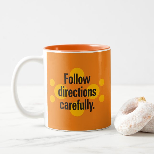Follow directions carefully Orange Spots Orange BG Two-Tone Coffee Mug (With Donut)