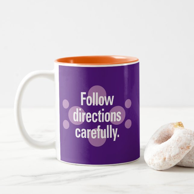 Follow directions carefully Violet Spots Purple BG Two-Tone Coffee Mug (With Donut)