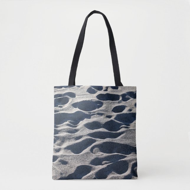 Foot prints on sand during daytime tote bag (Front)