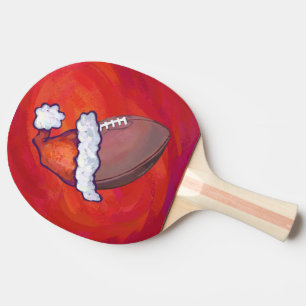 Football in Santa Hat on Red Ping Pong Paddle