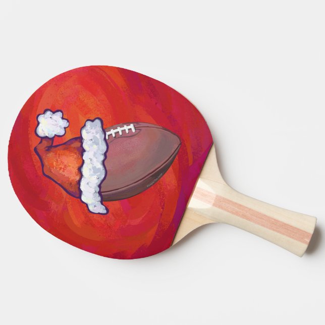 Football in Santa Hat on Red Ping Pong Paddle (Side)