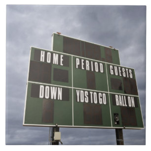 Football scoreboard and storm clouds. tile