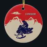 For Snowmobilers Snowmobile Graphic Personalised Ceramic Tree Decoration<br><div class="desc">Create a personalised gift for your favourite snowmobiler. This Christmas tree ornament has a vintage style illustration of a snowmobile and rider in navy blue set against a backdrop of cream or ivory coloured mountains against a red background. It's ready to be personalised with a name in cream and blue...</div>