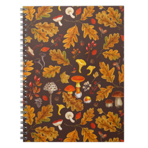 Forest mushrooms and autumn flora on brown notebook