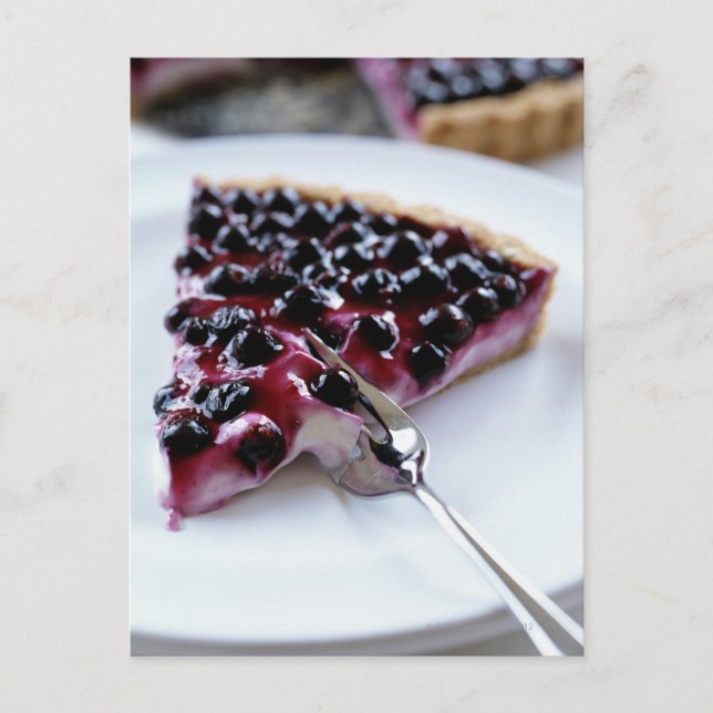 Fork slicing blueberry pie on plate postcard (Front)