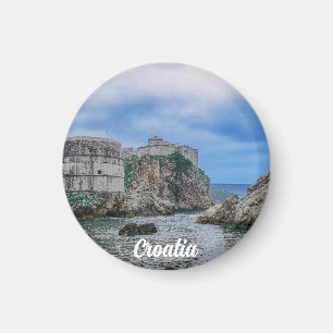 Fortress walls, rocky coast and sea in Croatia Magnet