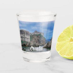 Fortress walls, rocky coast and sea in Croatia Shot Glass