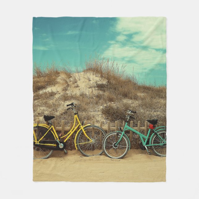 Four assorted-colour commuter bikes near hill at d fleece blanket (Front)
