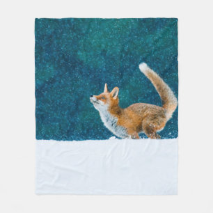 Fox in snowfall. Red fox, Vulpes vulpes, jumping i Fleece Blanket