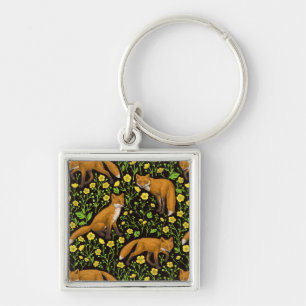 Foxes and buttercups on black key ring