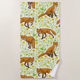 Foxes and buttercups on natural white beach towel