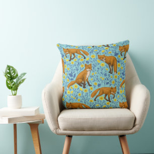Foxes and buttercups on pool blue cushion