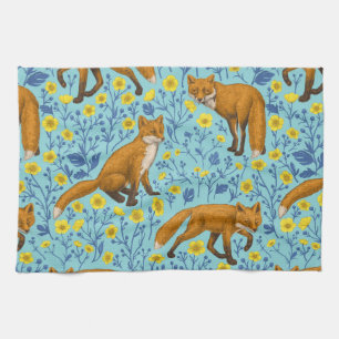 Foxes and buttercups on pool blue tea towel