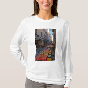 France, Corsica. Tables of cafe set up in narrow T-Shirt