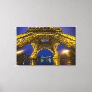 France, Paris. Eiffel Tower illuminated at Canvas Print