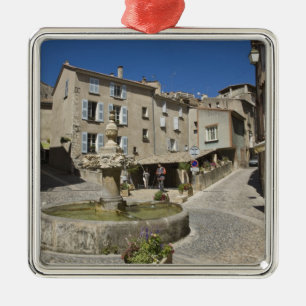 France, Provence, Valensole. Tourists explore Metal Tree Decoration