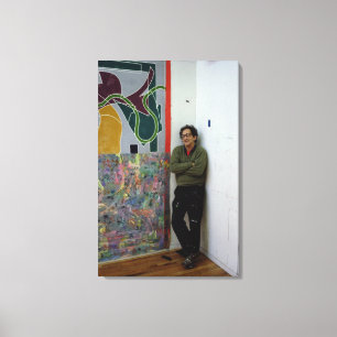 Frank Stella beside one of his works Canvas Print