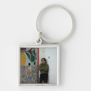 Frank Stella beside one of his works Key Ring