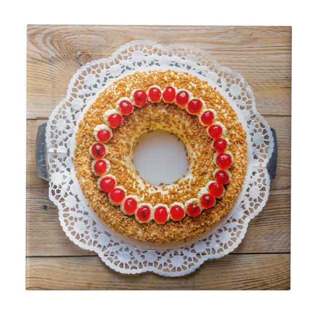 Frankfurt crown cake with cherries on rustic wood tile (Front)