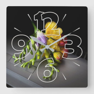 Freesias under spotlight square wall clock