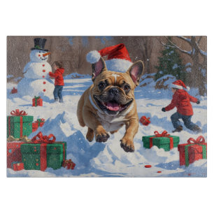 French Bulldog Running in Snow with Christmas Hat Cutting Board