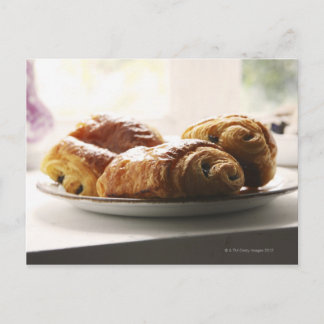 french croissants on a plate postcard