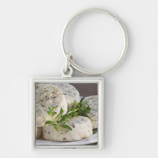 French goat cheese - chevre - with herbs on a key ring (Front)