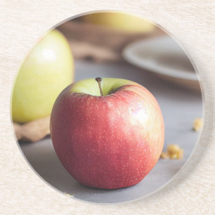 Fresh red apples on the table, apple pie crumbs coaster