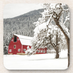 Fresh snow on red barn coaster