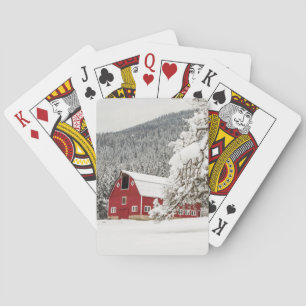 Fresh snow on red barn playing cards